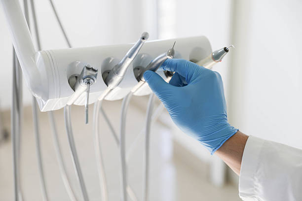 Professional Tooth Extraction technician working in Saginaw, MI